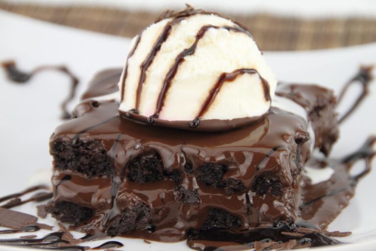 A Scoop of Ice Cream on Top of a Brownie