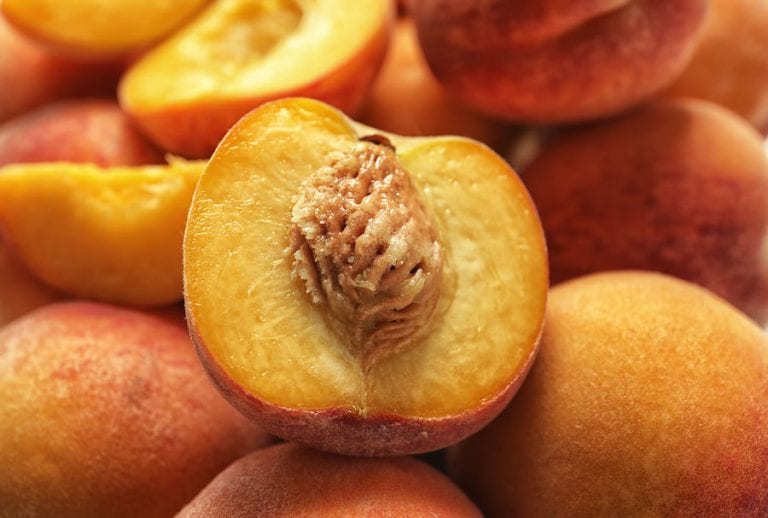Pile of delicious ripe peaches