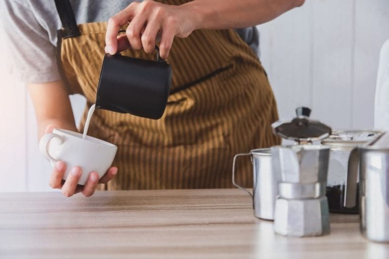 Pouring Milk in Coffee