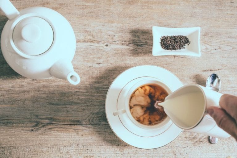 Pouring Milk into a Tea Cup
