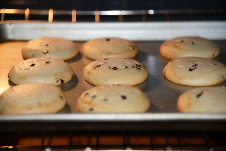 Puffy Cookies on a Baking Sheet in the Oven