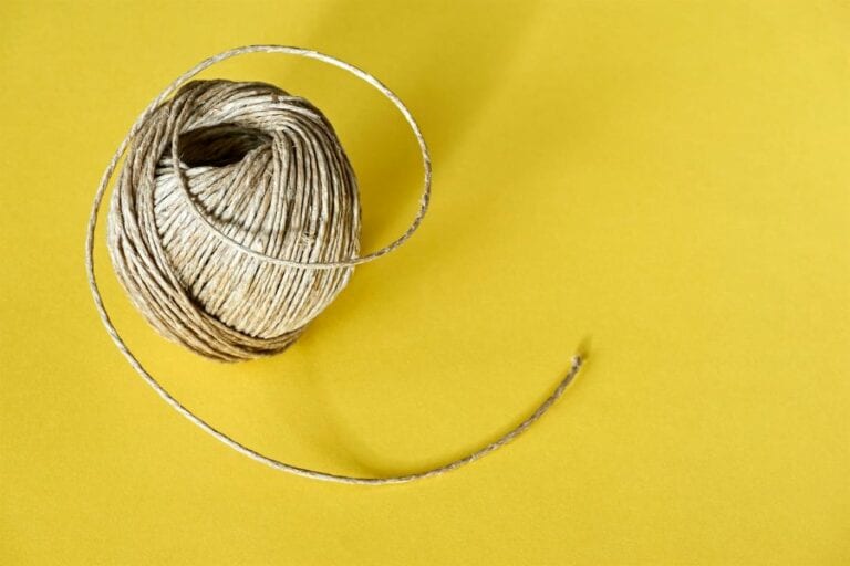 Roll of Natural Sisal Twine on Yellow Background