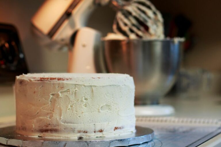 Buttercream Crumb Coat on a White Cake