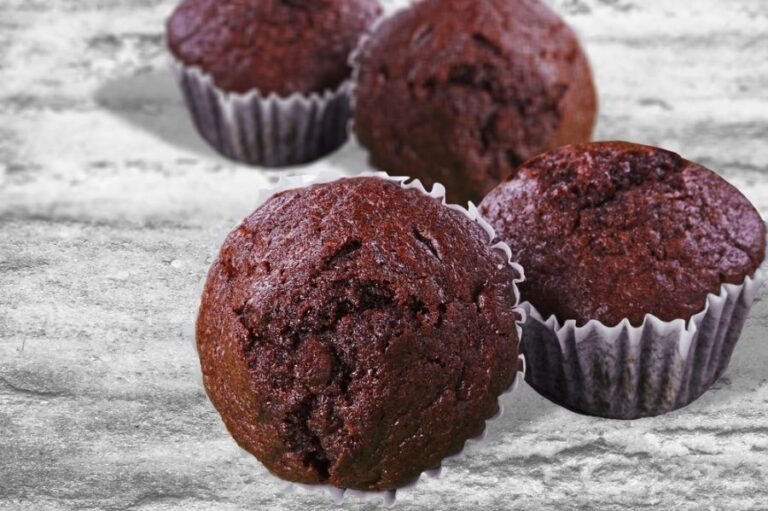 Fluffy Chocolate Muffins on Wooden Table