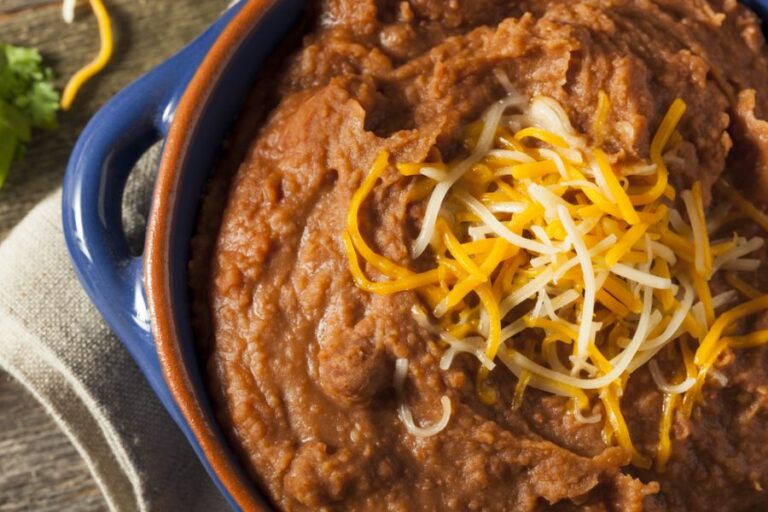 Homemade Refried Pinto Beans in Blue Serving Bowl