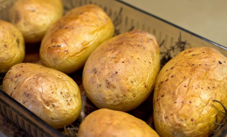 Baked Potatoes With Herbs in Glass Dish