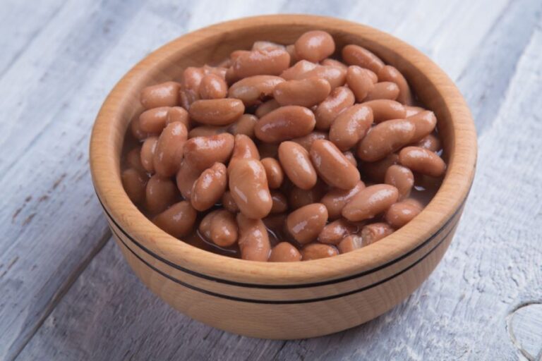 Cooked White Beans in a Bowl on a Wooden Table