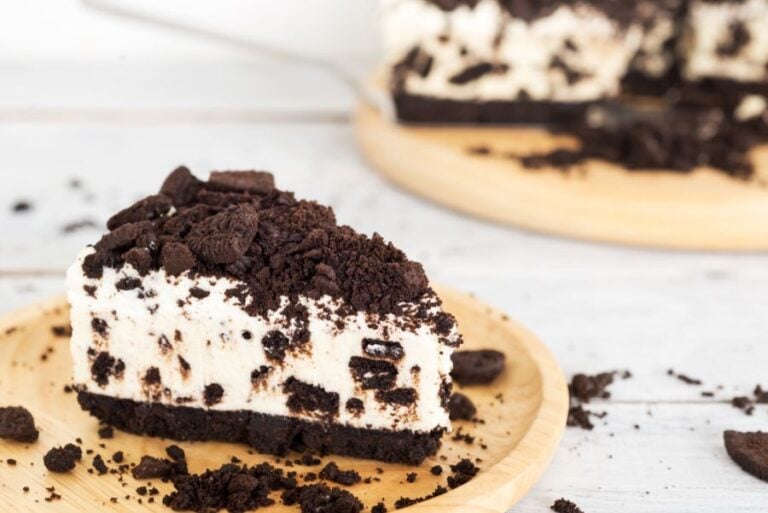 Slice of Cookies and Cream Cheesecake on Plate