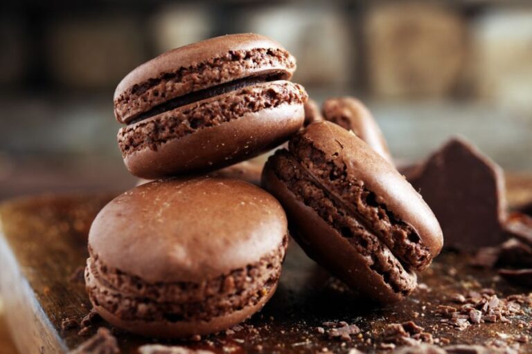 Sweet Chocolate Macarons on a Wooden Table