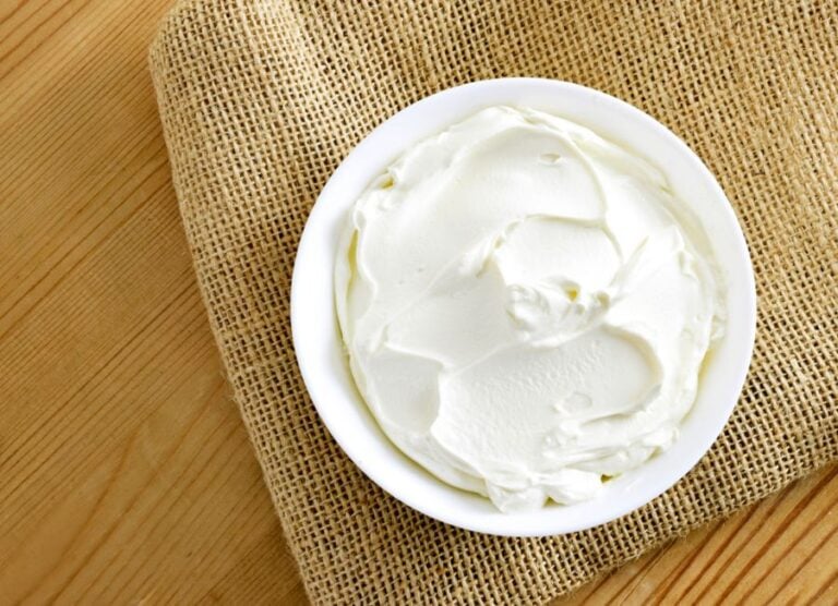 Bowl of Cream Cheese on a Wooden Table