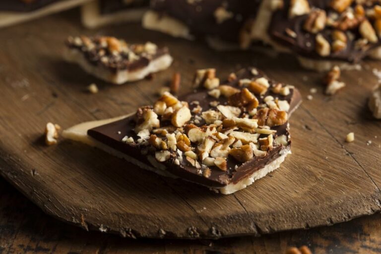Chocolate English Toffee With Nuts on Wooden Cutting Board