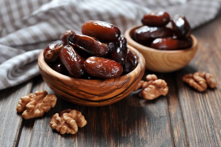 Dates in Small Wooden Bowls With Walnuts