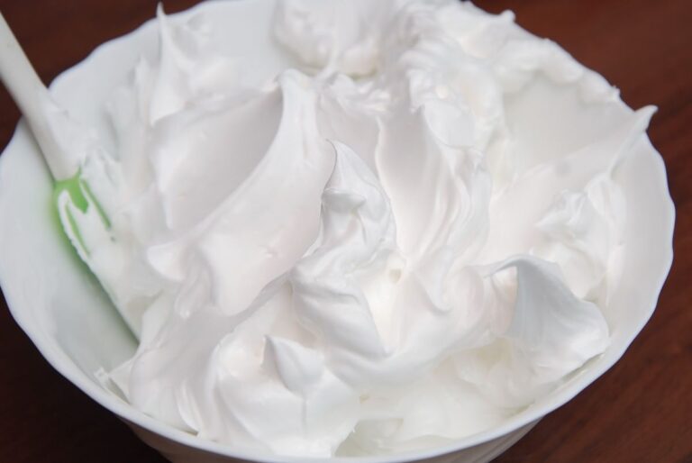 Whipped Meringue in a Bowl With a Spatula