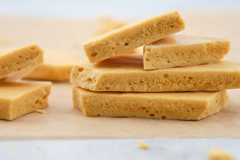 Broken Pieces of Honeycomb Toffee on a White Background