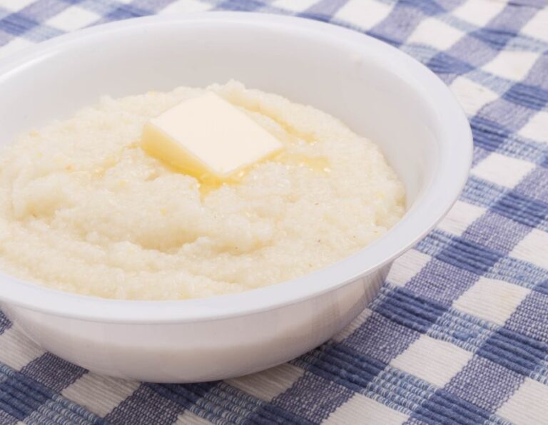 Bowl of Buttered White Corn Grits on a Blue Checked Placemat