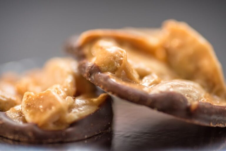 Two Pieces of Chocolate Covered Toffee With Almonds