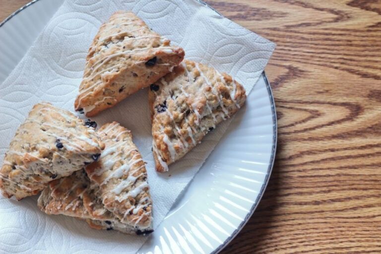 Blueberry Scones With a Drizzle Served on a White Plate