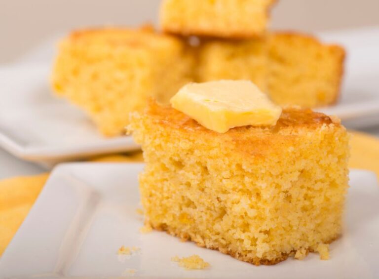 Piece of Fresh Cornbread With a Pat of Butter on Top