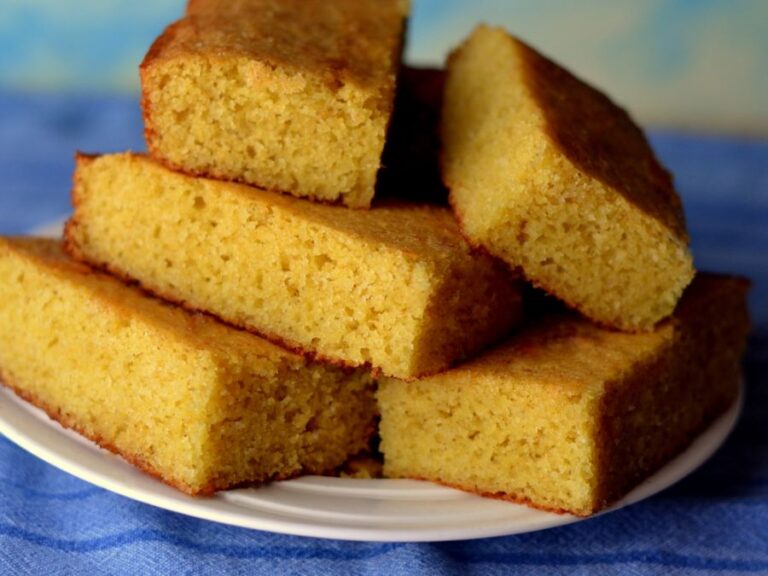 Thin Pieces of Cornbread Stacked on a White Plate