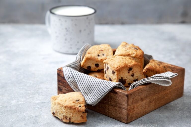 Chocolate Chip Scones in a Wooden Box With a Mug in the Background