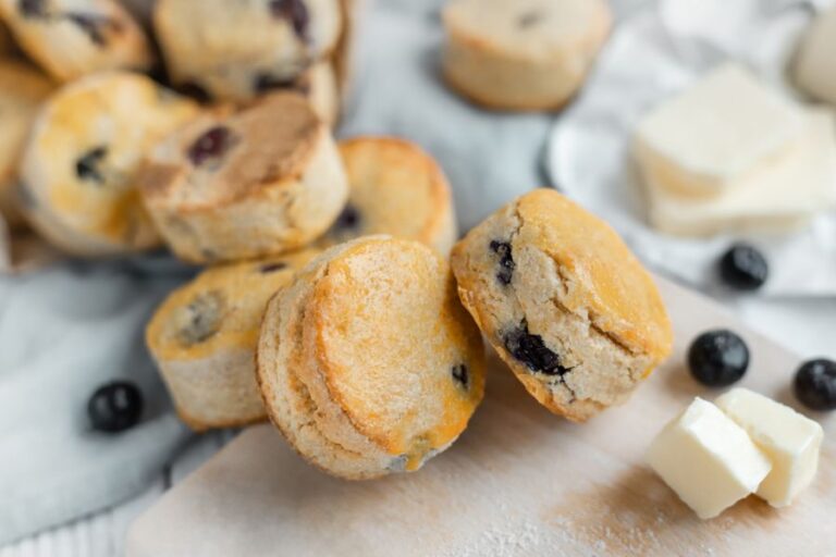 Several Round Scones With Blueberries and Butter
