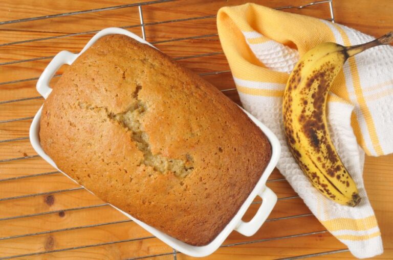 Fluffy Hot Loaf of Banana Bread on a Cooling Rack
