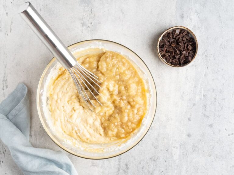 Banana Bread Batter in a Bowl With a Whisk