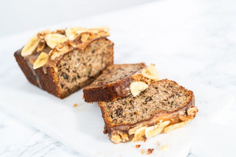 Banana Nut Bread With a Caramel Sauces Sliced on a Cutting Board