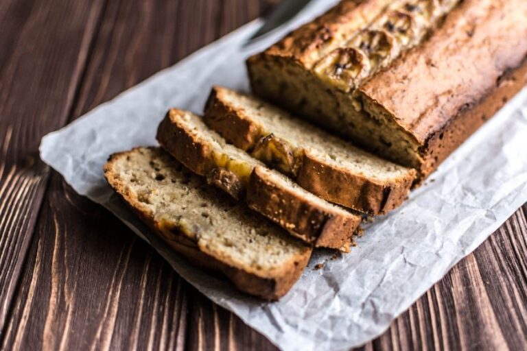 Sliced Banana Bread on Parchment Paper on a Table