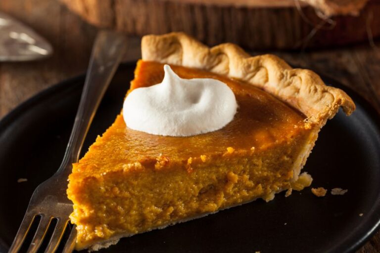 Delicious Piece of Pumpkin Pie on a Black Plate