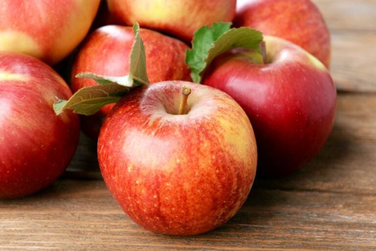 Ripe Red Apples on a Wooden Table
