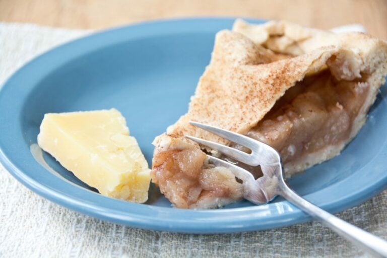 Slice of Apple Pie Served With a Piece of Cheddar Cheese