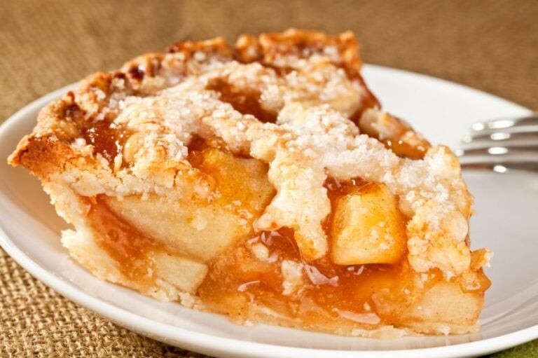 Slice of Apple Pie on a White Plate