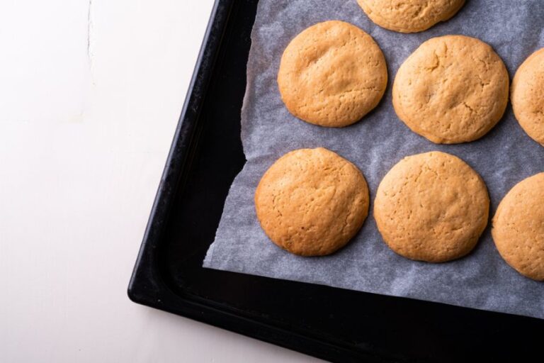 Homemade Shortbread Cookies on Parchment Paper and a Baking Sheet