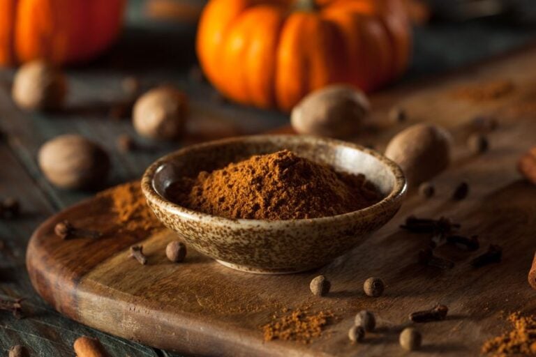 Freshly Mixed Pumpkin Pie Spice in a Bowl on a Cutting Board