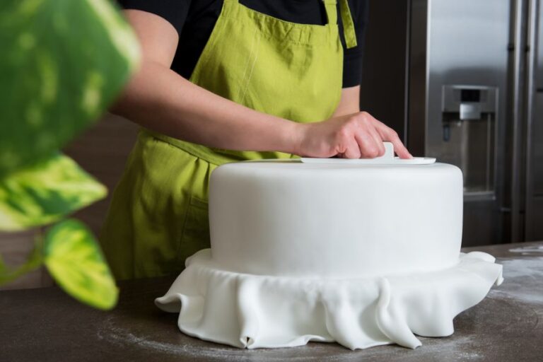 Fondant Being Smoothed Over a Cake