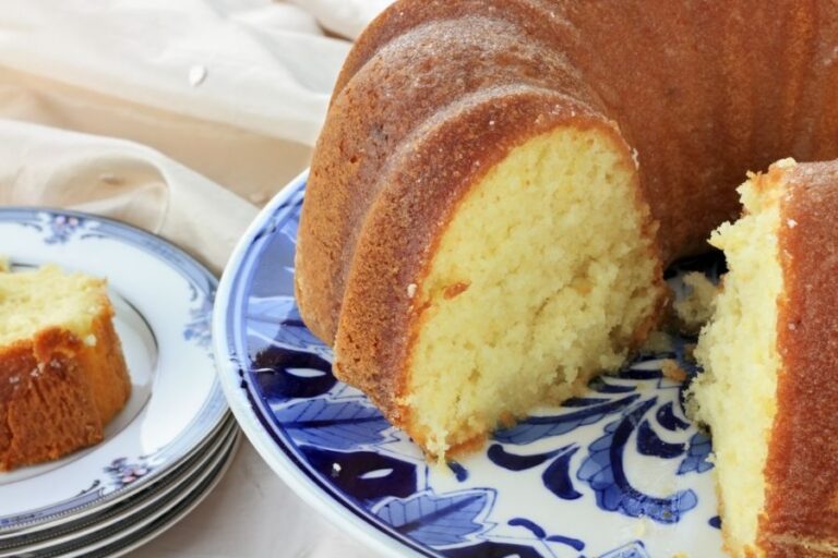 Sliced Lemon Bundt Cake on a Blue and White Plate