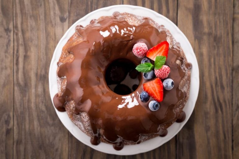 A Bundt Cake Topped with Chocolate Glaze and Fresh Fruit