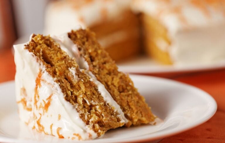Serving a Slice of Homemade Carrot Cake
