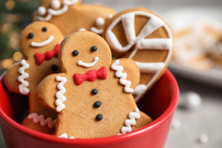 Decorated Gingerbread Cookies in a Red Cup