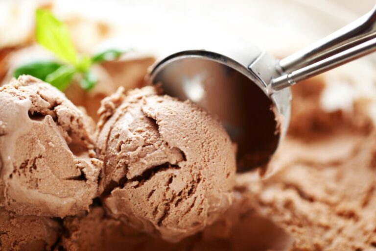 Scooping Ice Cream to Put on Fruit Cake