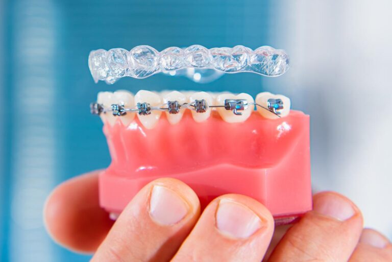 Dentist Holding Braces