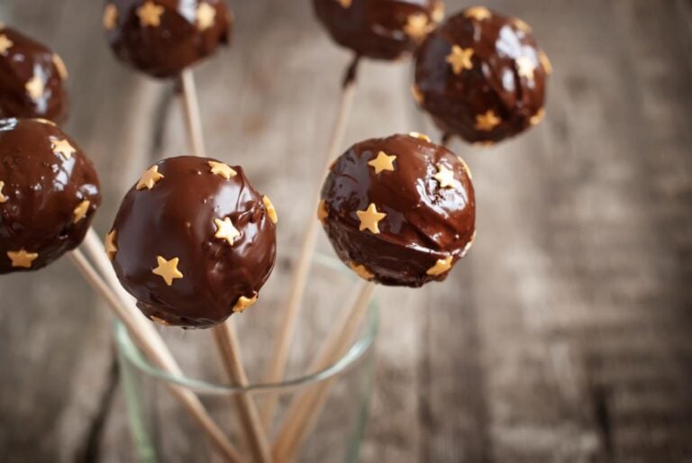 Chocolate Covered Cake Pops With Gold Stars on Wooden Skewers