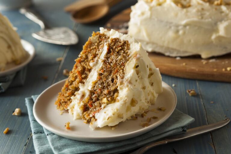 Slice of Homemade Carrot Cake on a White Plate