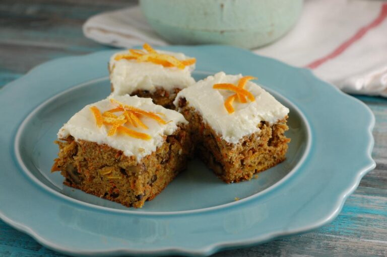 Slices of Carrot Cake With Cream Cheese Frosting on a Blue Plate