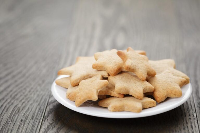 Star Shaped Sugar Cookies Stacked on a Plate