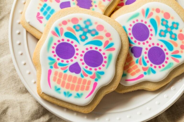 Colorful Sugar Skull Sugar Cookies on a White Plate