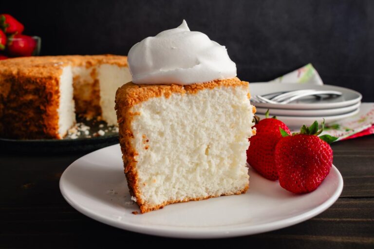 Slice of Angel Food Cake With Strawberries and Whipped Cream