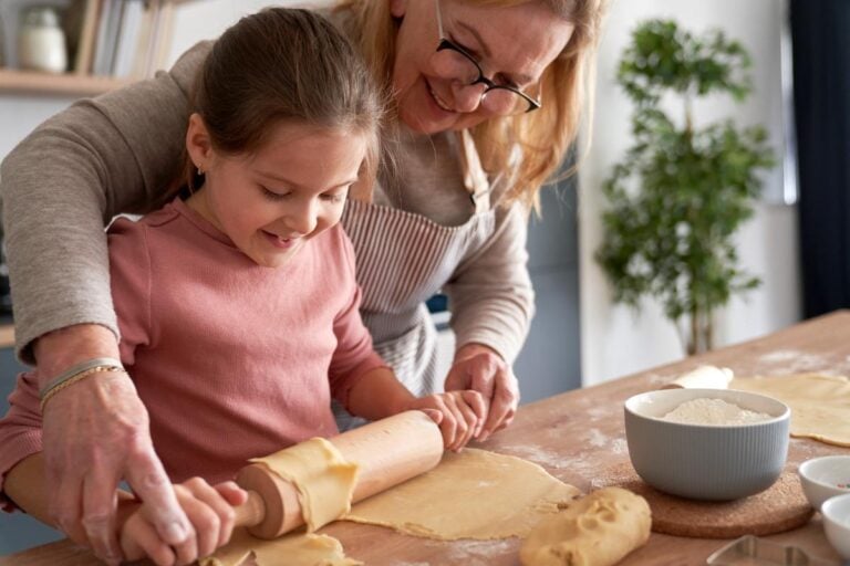 A grandmother and child baking together