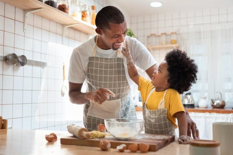 A young father baking with his child